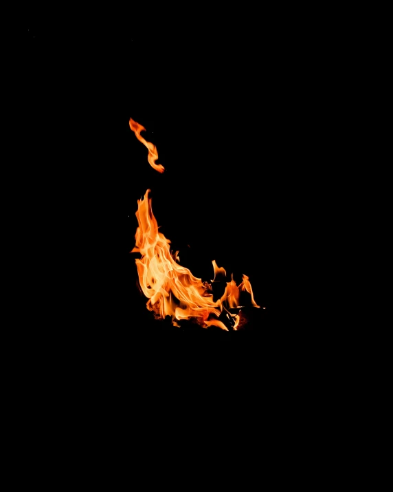 a picture taken of a dark background with a fire