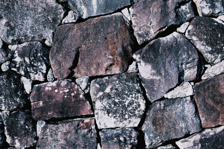 a wall made out of stones and some rocks