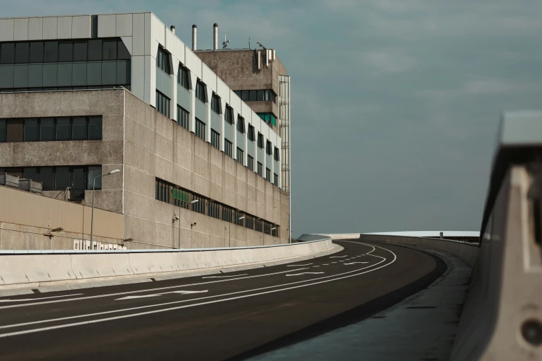 this is an asphalt road next to the building