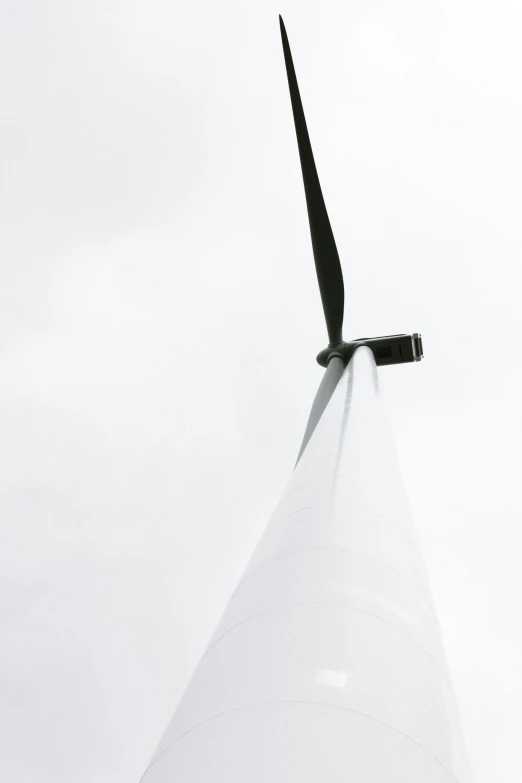 a black and white pograph of a wind turbine