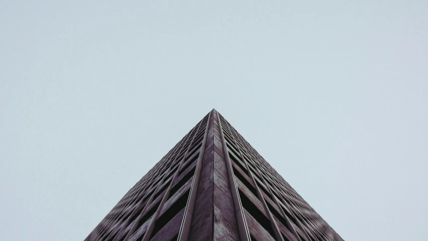 looking up at the top of a tall skyscr