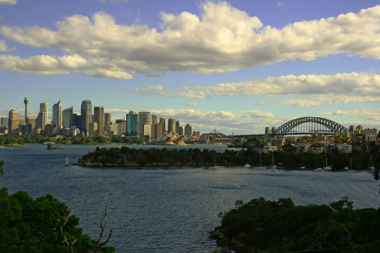 a large body of water with a city in the background