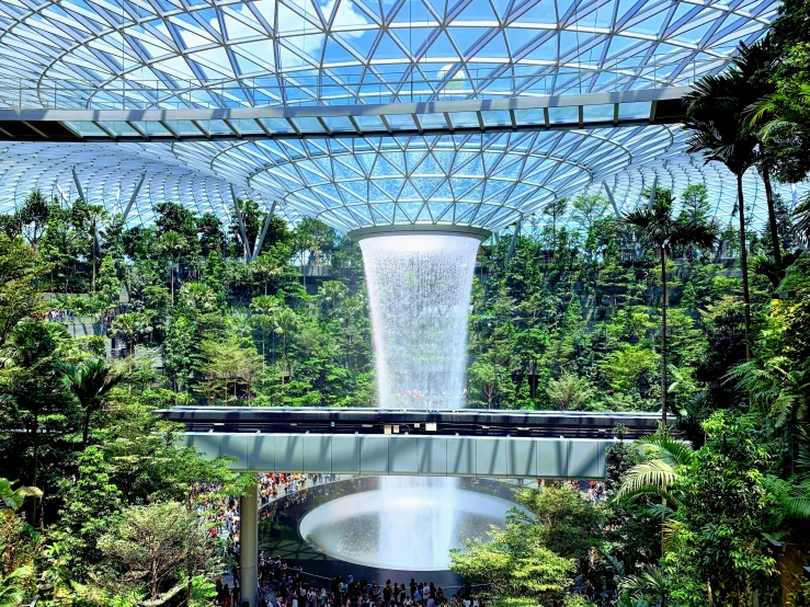 the view of an indoor waterfall from an inside atrium