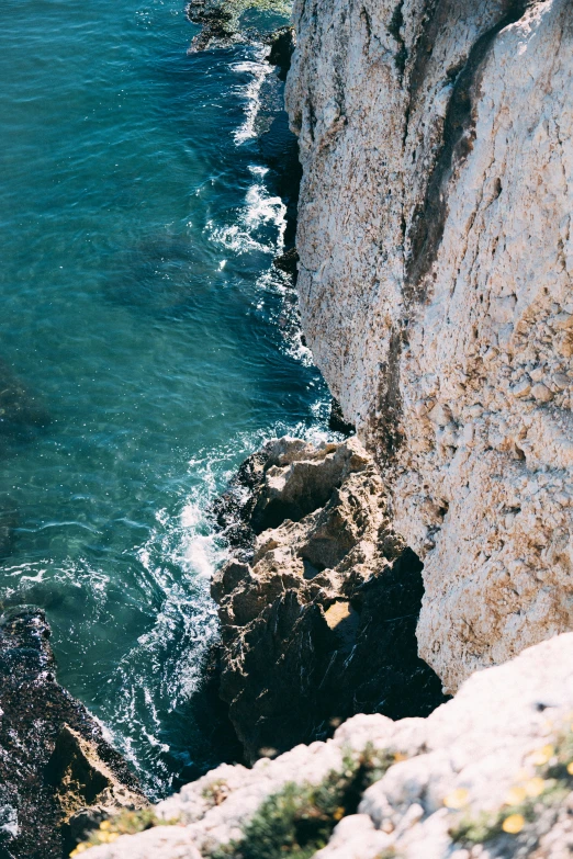 a view of the sea from above a cliff