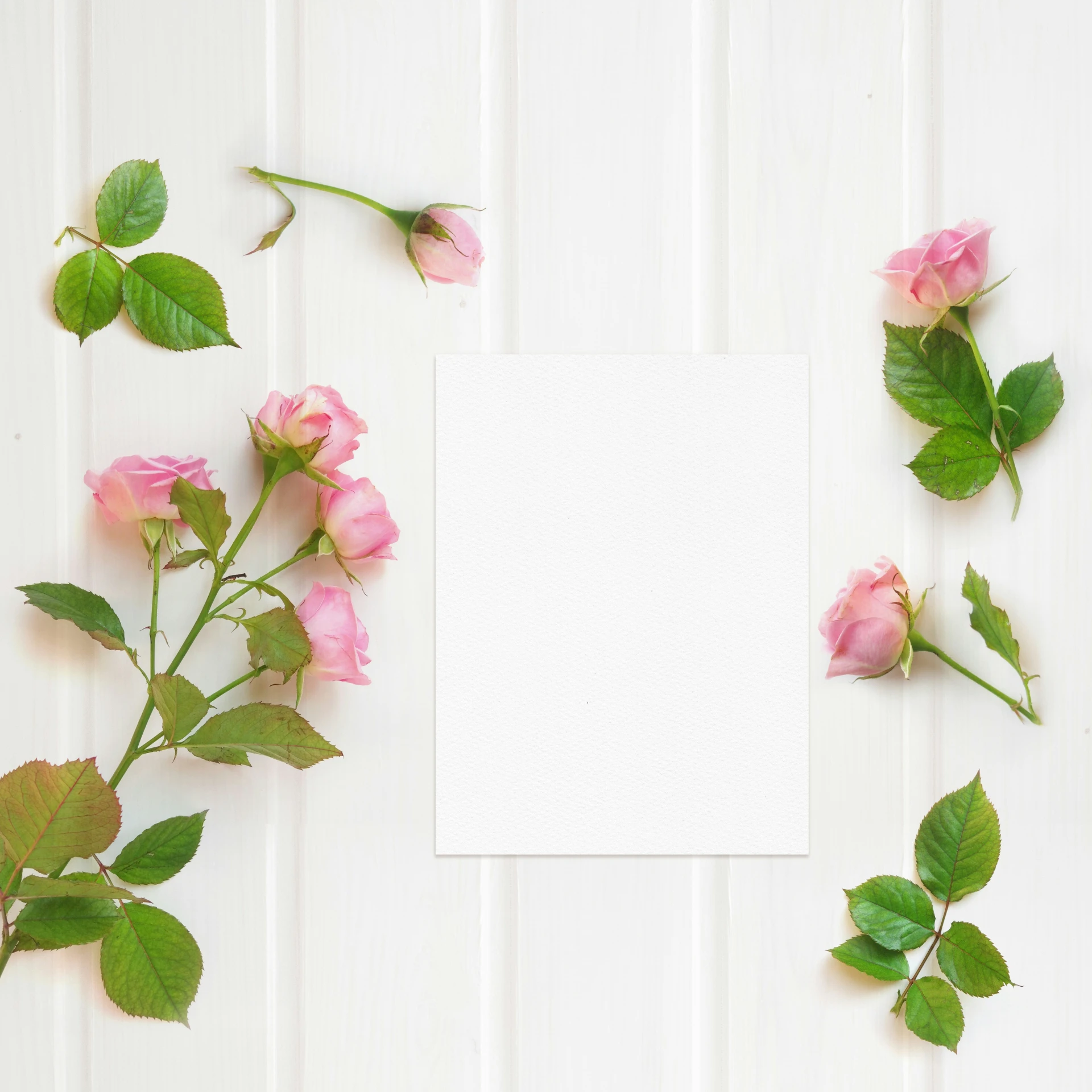 a table topped with pink roses on top of it