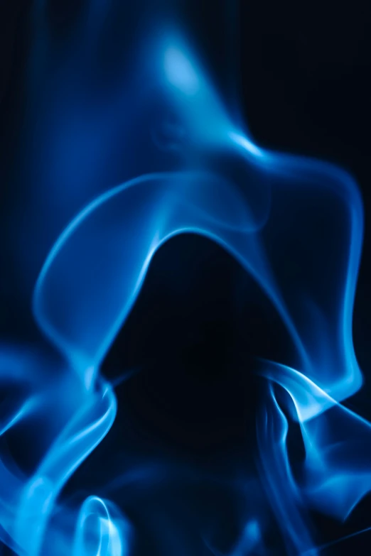 an abstract po with blue smoke on a black background