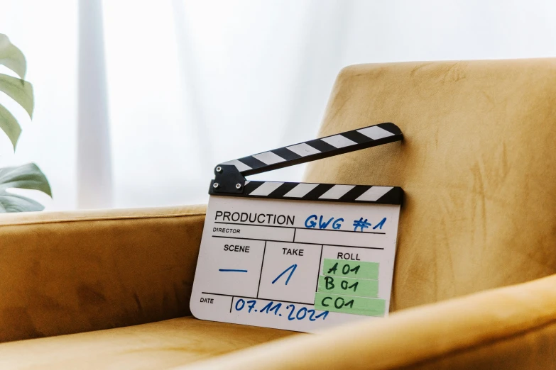 a film clap on top of a chair