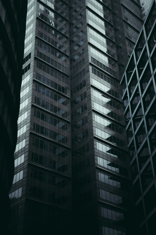 two high rise buildings next to each other