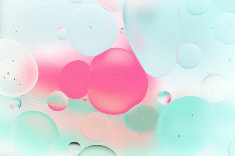 an abstract background of pink and blue balloons