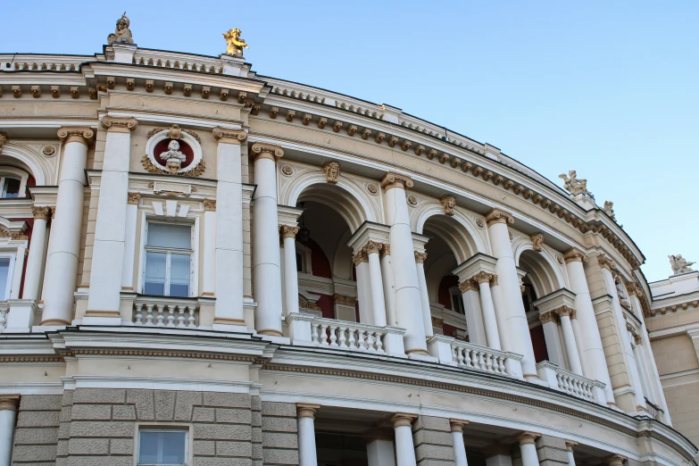 an old building with ornately decorated windows and balcony