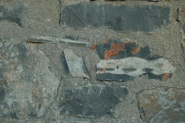 painting of people on a building that appears to be using concrete