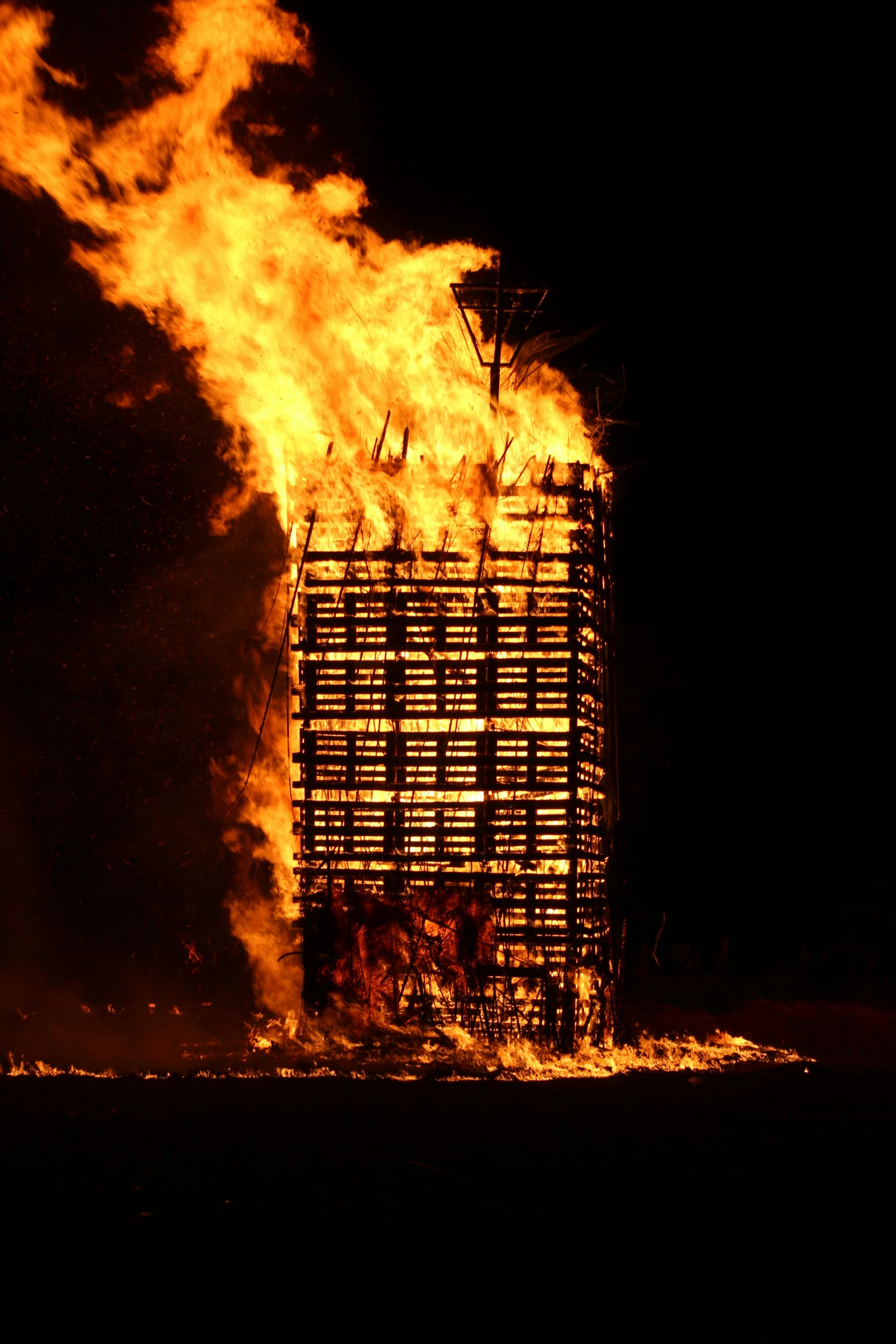 a massive fire blazing inside of a building