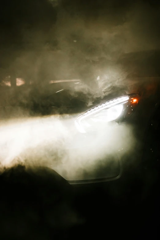 a white car parked on top of a dirt field