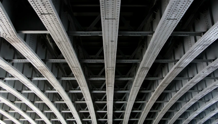 a view of part of a bridge taken from the bottom