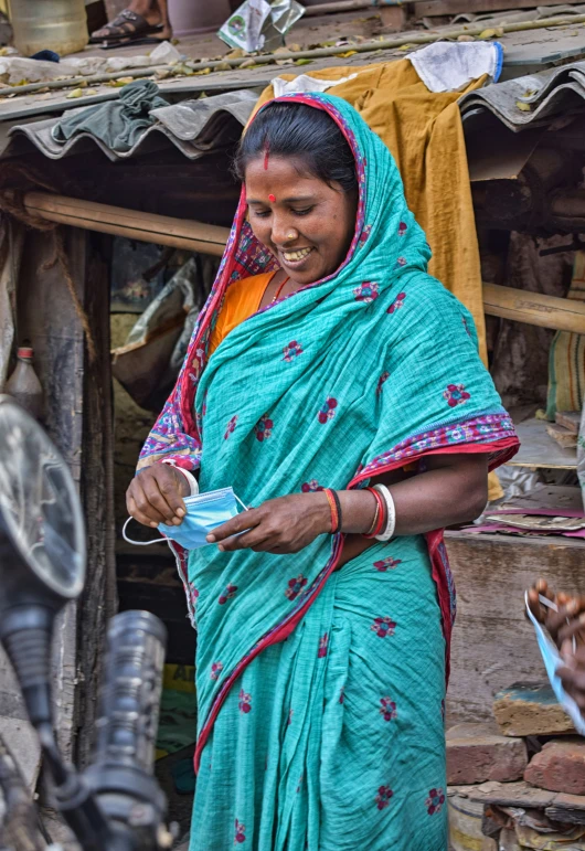 a lady standing in front of her store