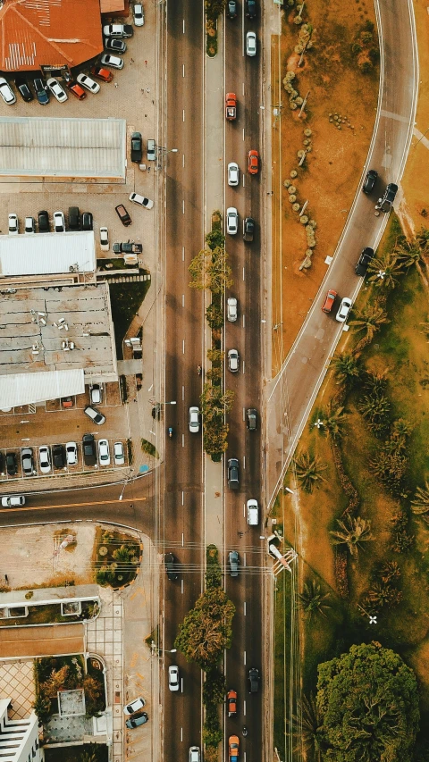 an aerial view of a street with cars on it