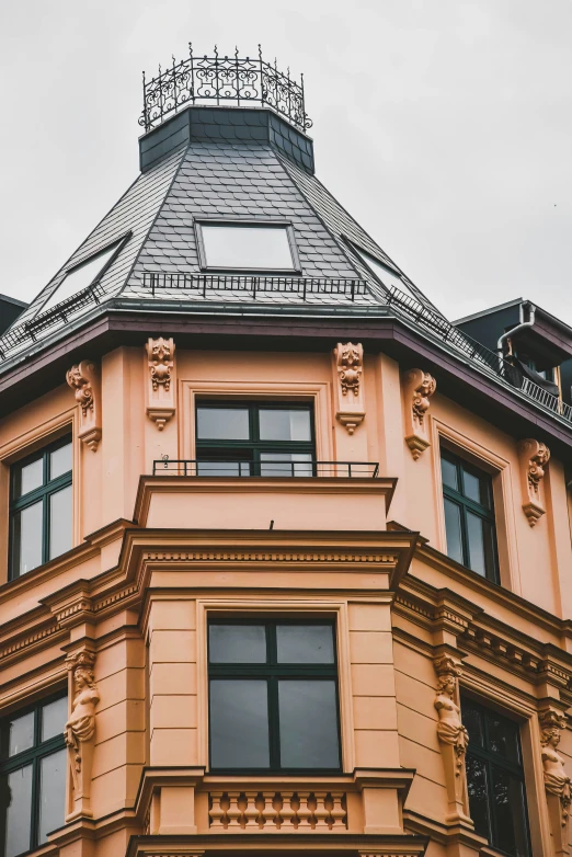 an image of an orange building taken from below