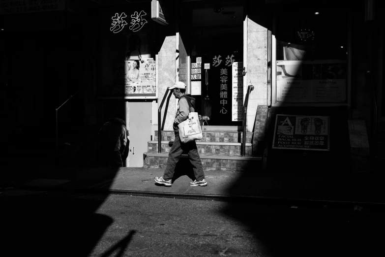 a man walking up stairs in front of a building