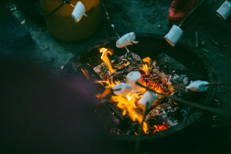 a small grill is full of food being cooked