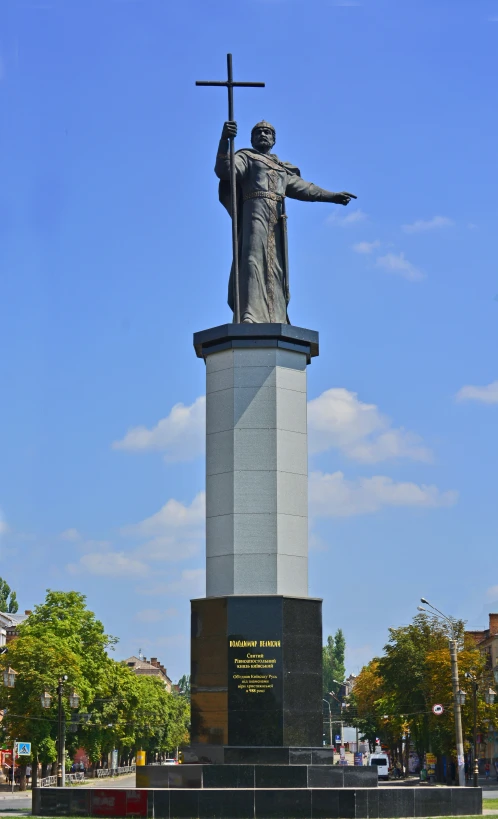 a statue of a man with a cross in his hand