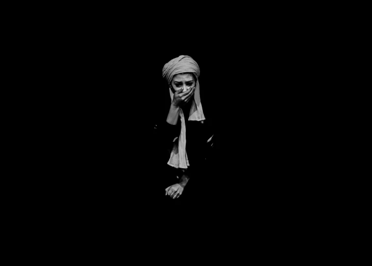 black and white pograph of woman in headscarf