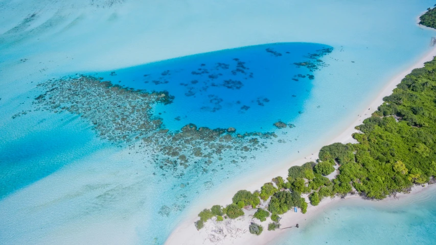 an aerial view of the ocean from a plane