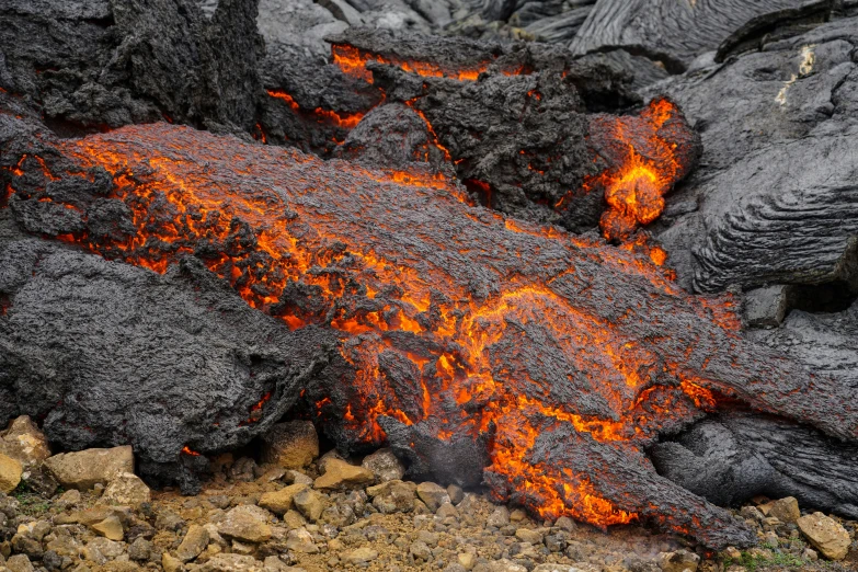 a large orange substance is seen coming out of the ground