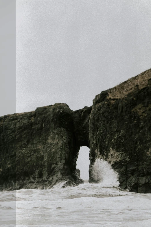 a picture of the ocean and rocks that have been pographed