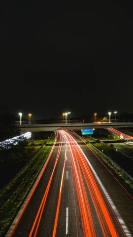 a freeway at night with a blurry picture of lights
