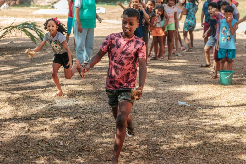 children are on the beach playing ball together