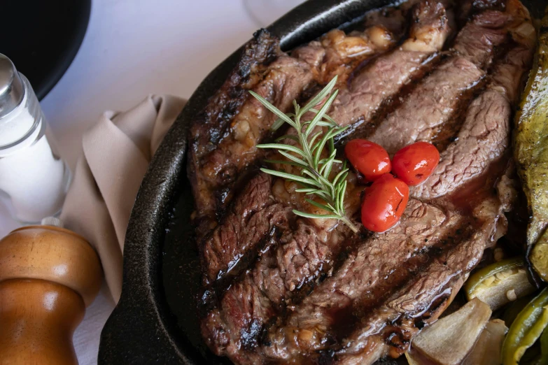 a steak and vegetables are shown on a tray