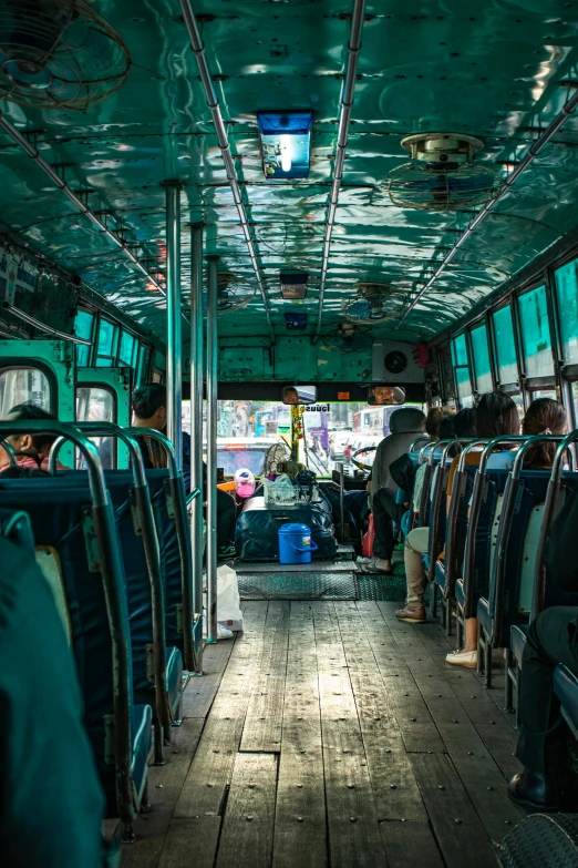 several people are on the inside of an old bus