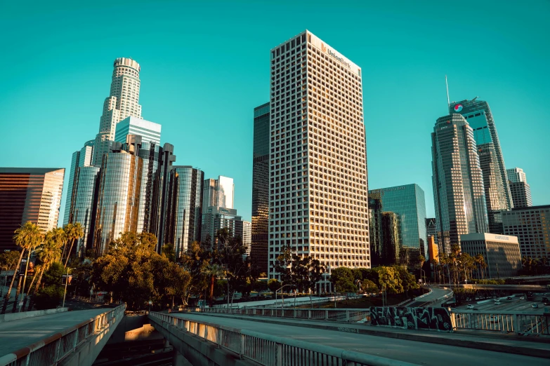 a very tall city block towering over a highway