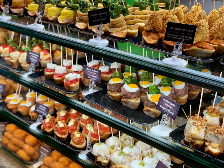 an array of small snacks for sale in a supermarket