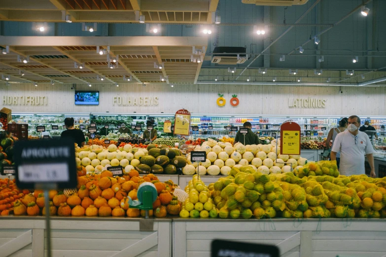 an produce section at a grocery store filled with fresh fruits