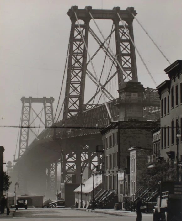 a view of a city with a bridge in the background