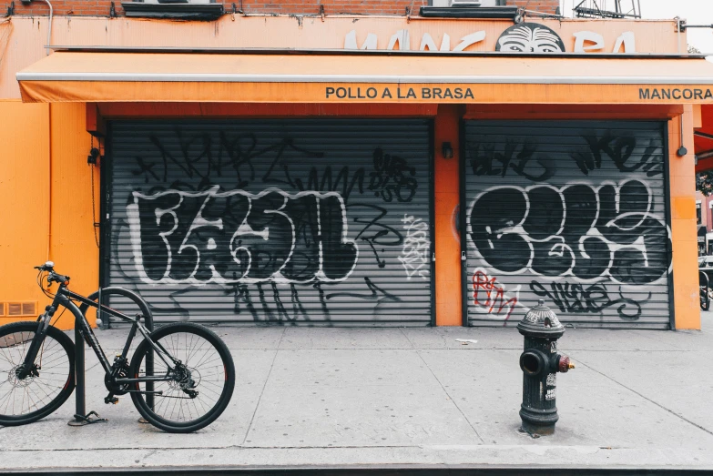 the bike is parked outside of the store front