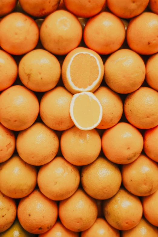 the oranges are stacked up together for display