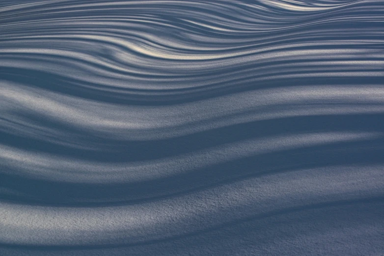 an abstract background of sand as it appears to be blowing in the wind