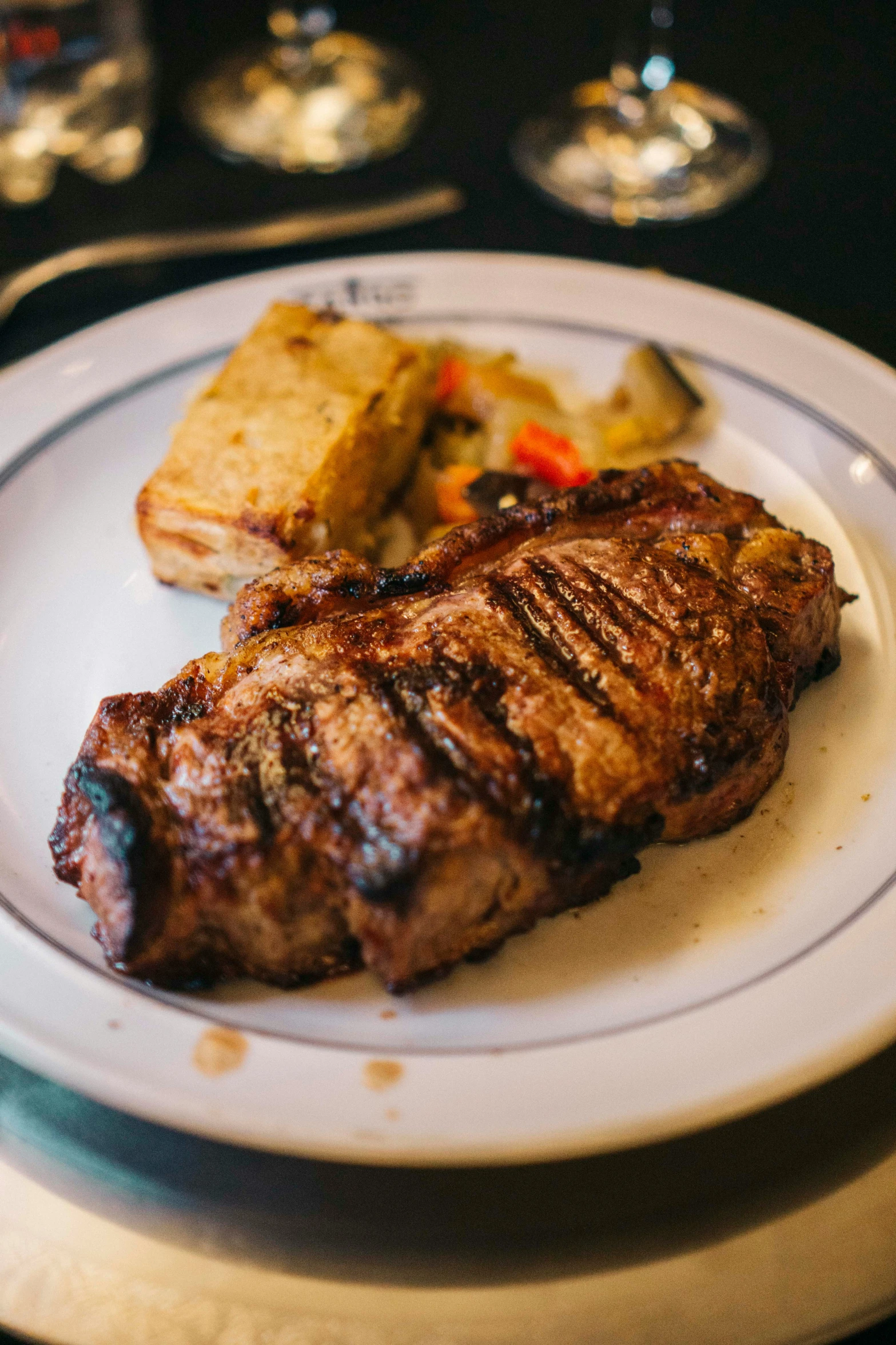 a white plate topped with meat and side dishes