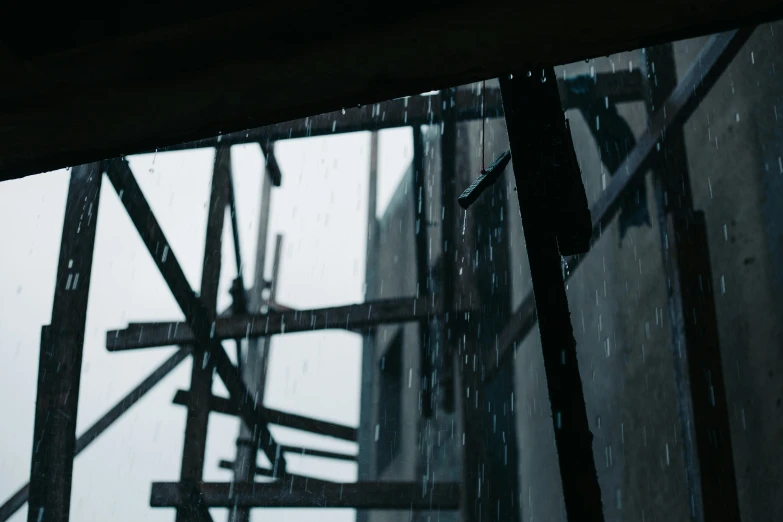 view of the outside of a tall building through the rain