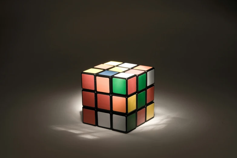 a rubik cube is shown against a gray background