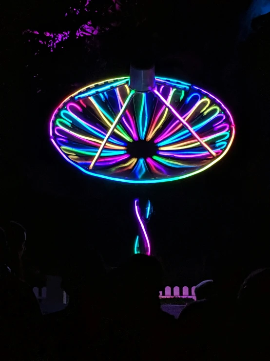 neon lights and a wheel of fortune, on display