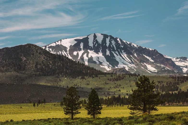 the snow covered mountain is shown in the distance