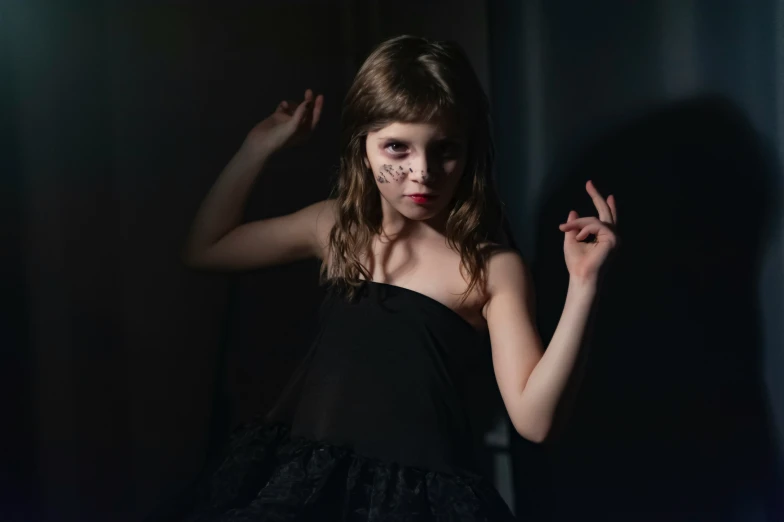 a woman with red lipstick and black dress posing for a camera