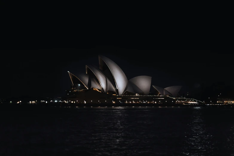 a night view of the sydney opera house with bright lights