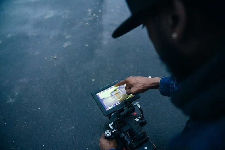 a man taking pictures with a camera in his hand