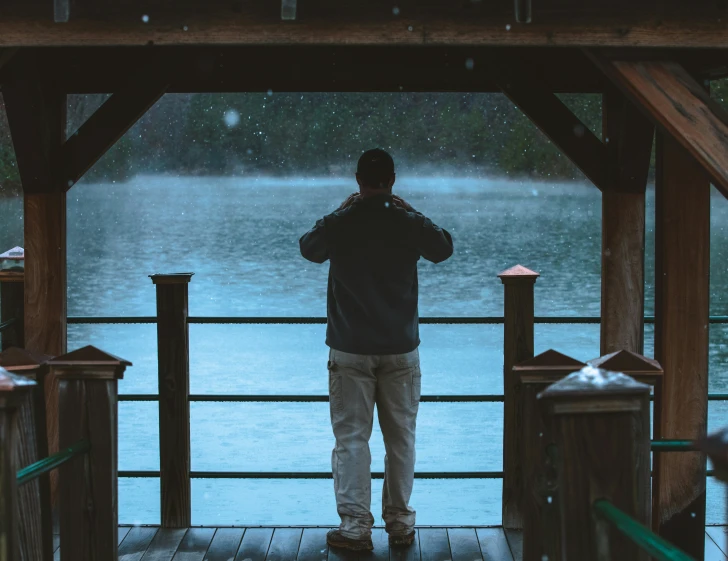 a man that is standing on a dock