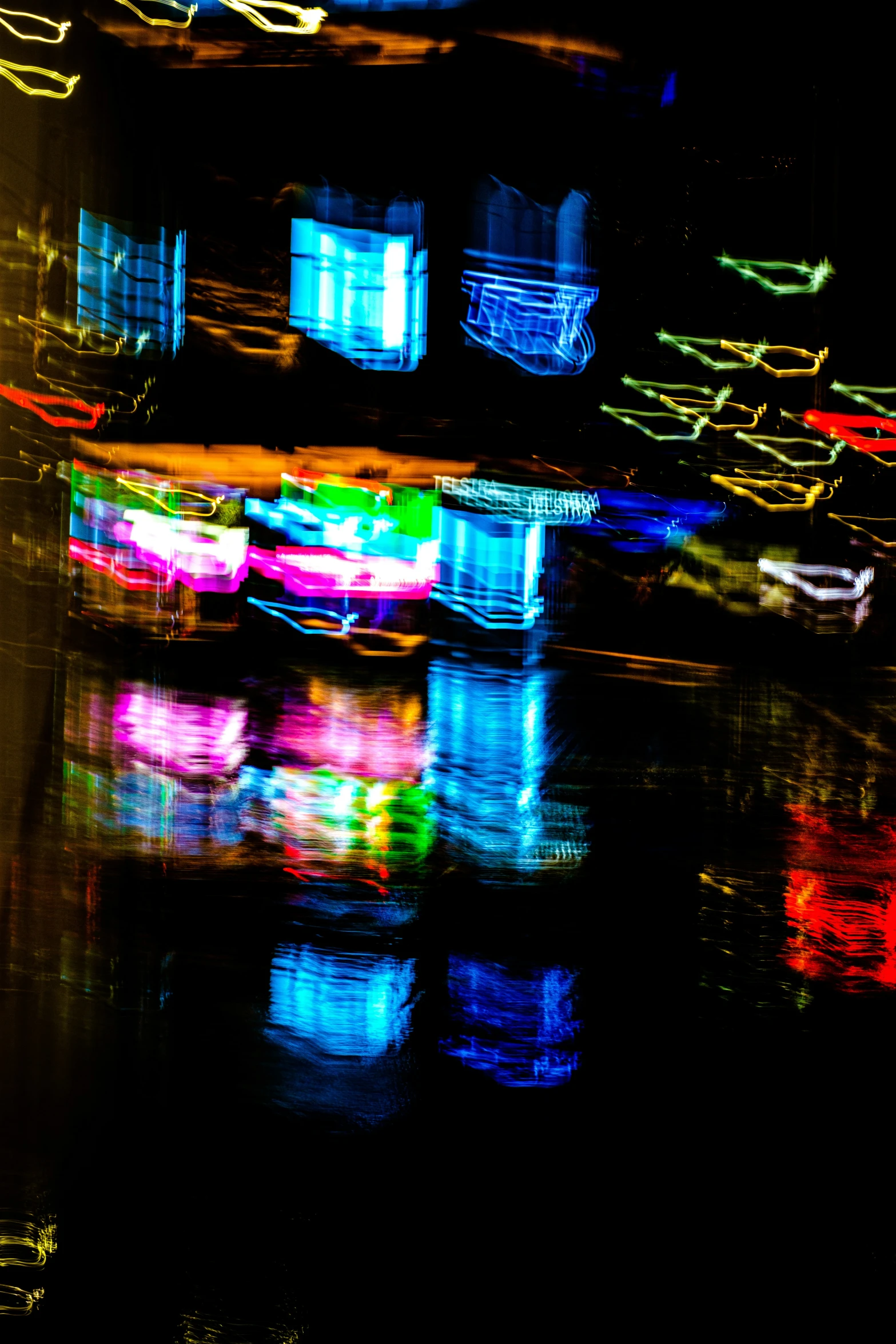 blurry pos of a large container ship in water at night