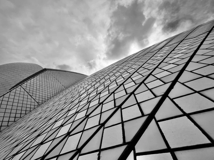 black and white pograph of the side of a building with lots of windows